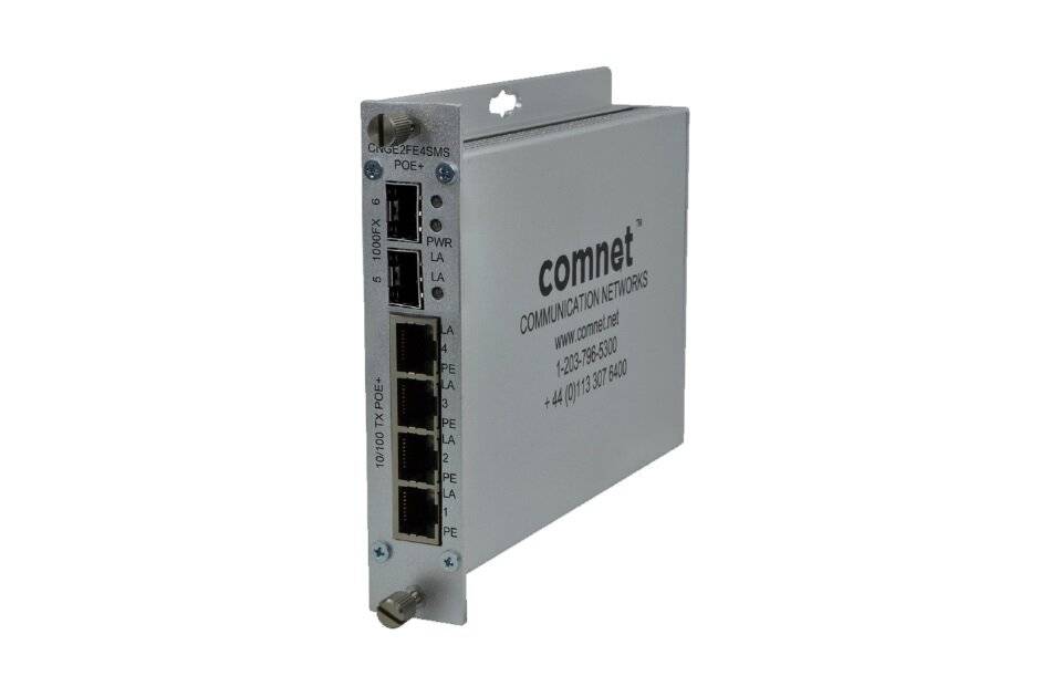 Industrielles ComNet-Kommunikationsnetzwerk-Modul mit mehreren Ethernet-Anschlüssen und Statusanzeigen, dargestellt in einem grauen Metallgehäuse.