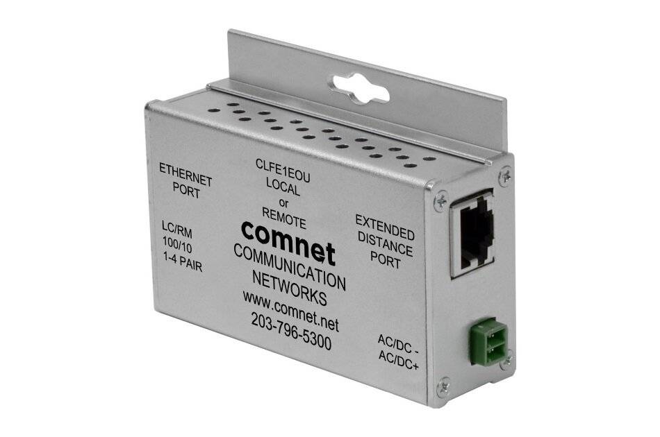 Silbernes ComNet Kommunikationsgerät mit Ethernet-Anschluss, Ferneinstellungsetiketten und Webadresse ‚www.comnet.net' mit Telefonnummer.