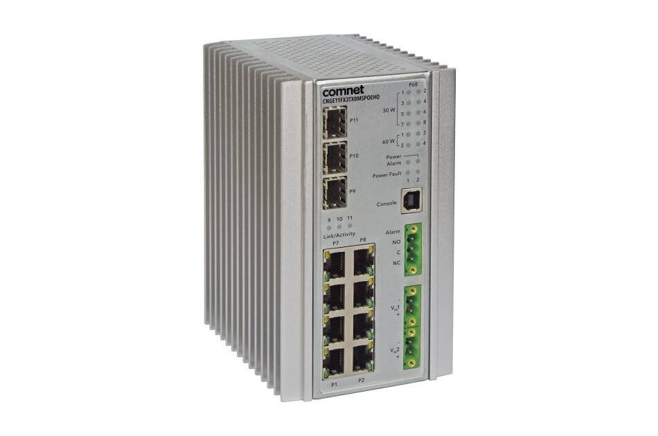 ComNet Ethernet-Switch mit mehreren Anschlüssen und Statusanzeigen; Metallgehäuse; verwendet für industrielle Netzwerkverbindungen.
