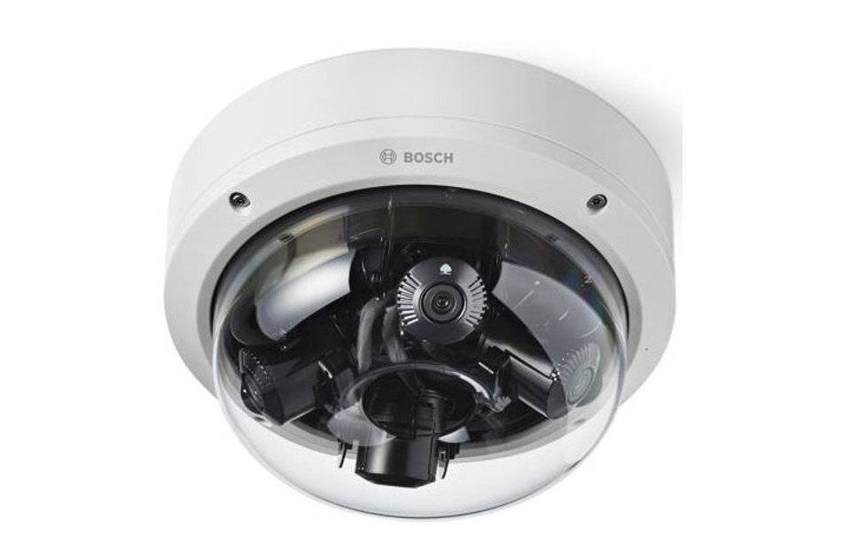Bosch-Kuppelsicherheitskamera mit transparentem Schutzgehäuse und sichtbarem internem Objektivaufbau, dargestellt vor weißem Hintergrund.