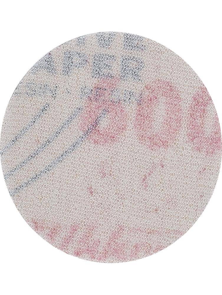 Detailaufnahme eines Währungssicherheitsmerkmals, die feine Mikrodruck-Zahlen und -Muster in Rot und Blau in einem kreisförmigen Bereich zeigt.