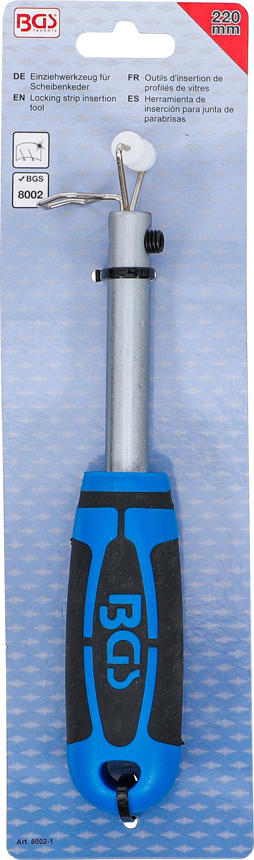 Ein Schraubendreher mit blau-schwarzem Griff liegt auf einer blauen strukturierten Oberfläche.