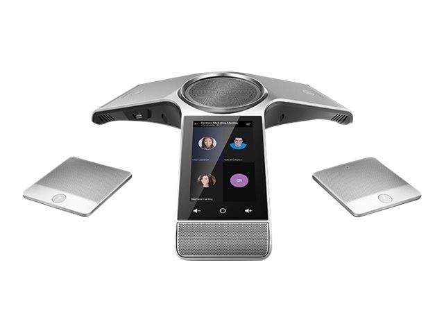 Konferenzraumfreisprechanlage mit Touchscreen-Display, umgeben von zwei kleinen kabellosen Geräten auf weißem Hintergrund.