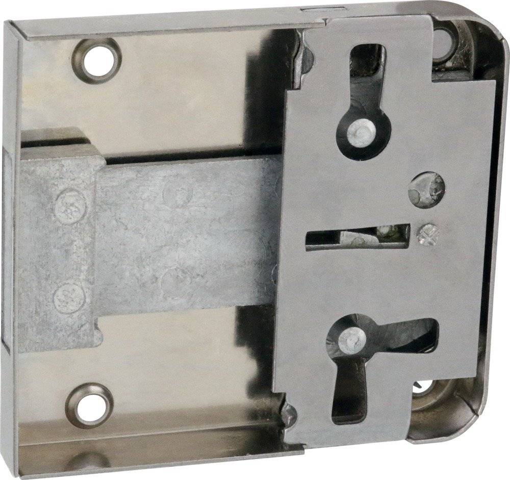 Rechteckiger Metallverschlussmechanismus ohne sichtbares Schlüsselloch, mit zwei runden Befestigungspunkten an der Kante und zahnradförmigen Komponenten.