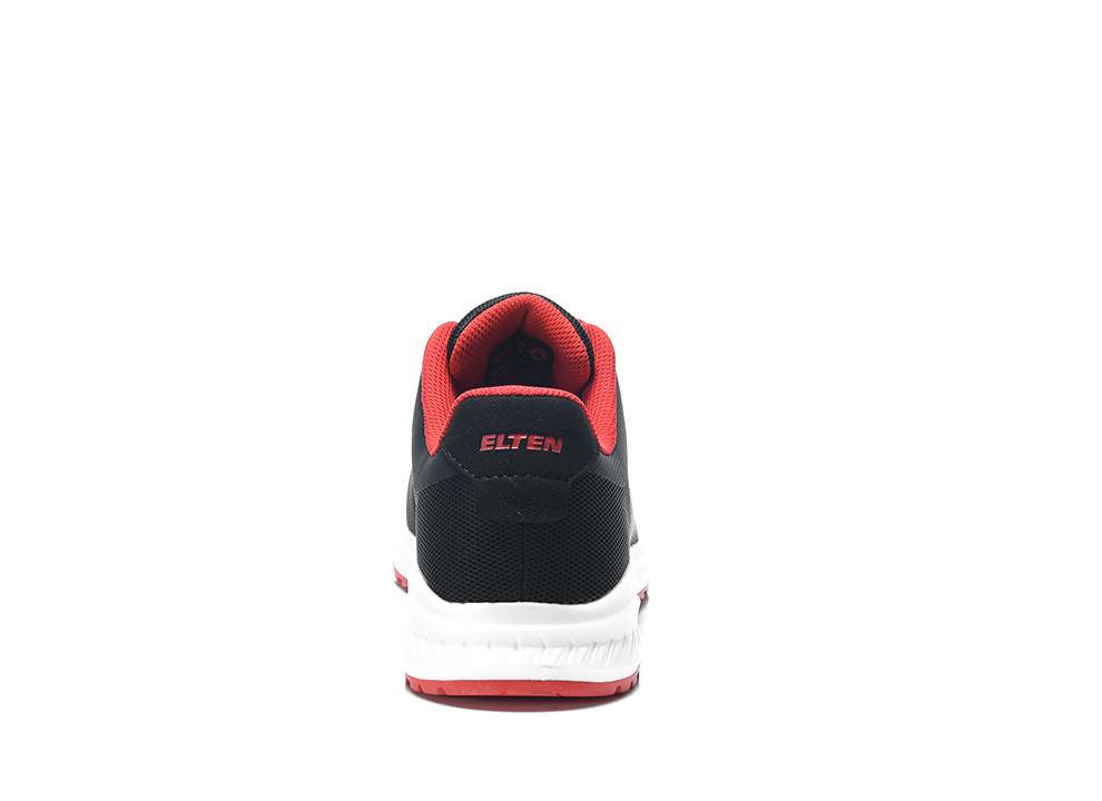 Eine Rückansicht eines schwarzen und roten Sneakers mit weißer Sohle, auf der Rückseite mit dem Markennamen 'ELTEN'.