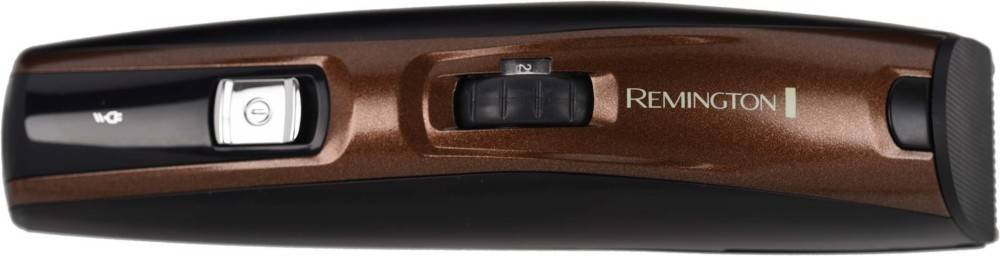 Eine Nahaufnahme eines dunkelbraunen elektrischen Rasierers mit Schieberegler, der mit '1' und '2' beschriftet ist und einstellbare Geschwindigkeitsstufen anzeigt.