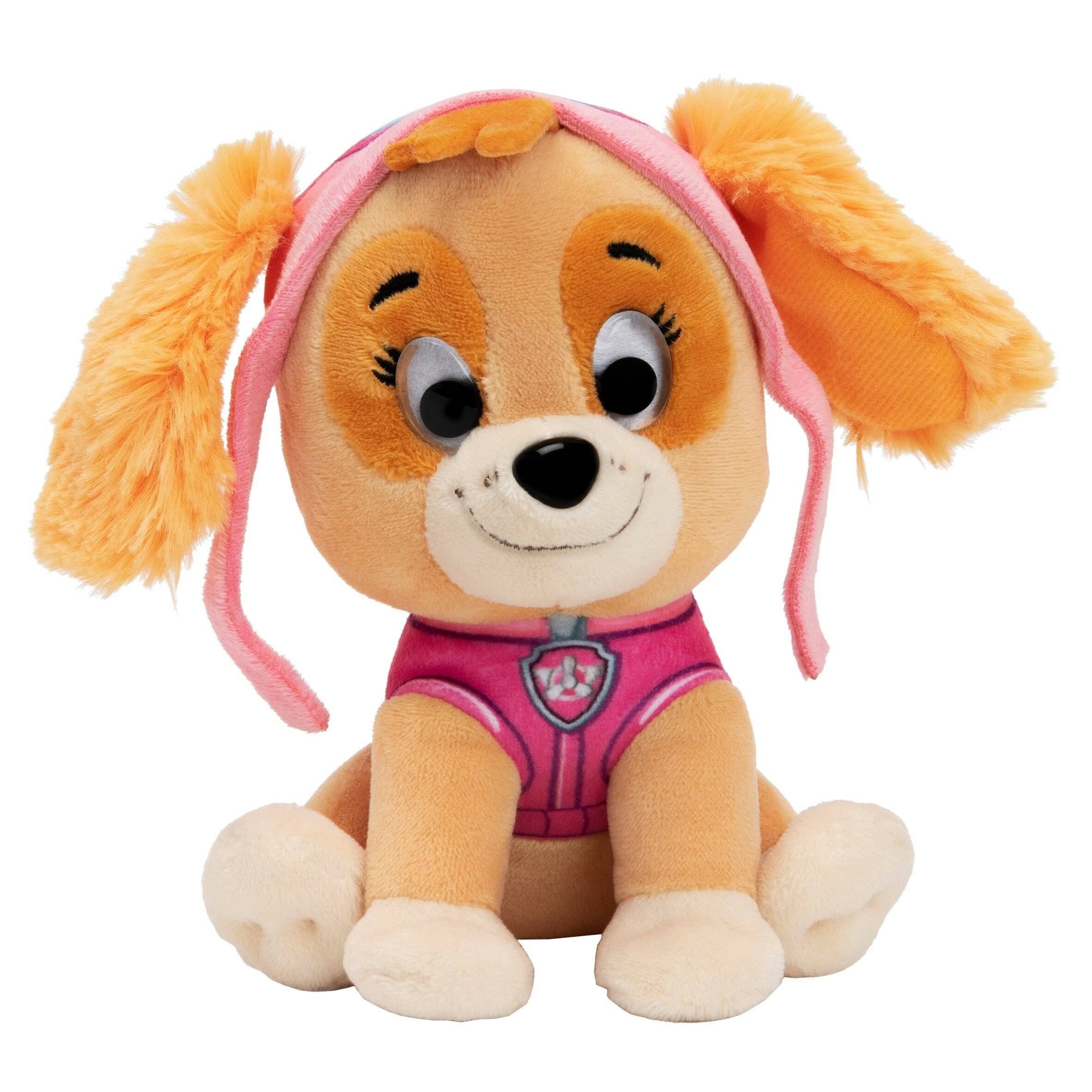 Kuscheliger Welpen-Spielzeug mit orangefarbenen Ohren und rosa Outfit, sitzt nach vorne schauend auf weißem Hintergrund.