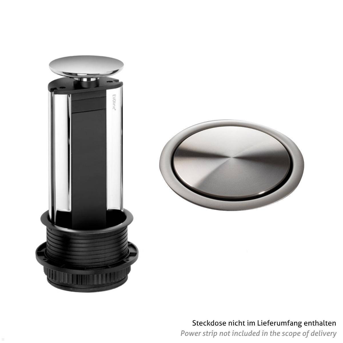 Ausklappbarer Steckdosenturm neben einer geschlossenen Steckdose mit silberner Abdeckung. Der Text besagt: Mehrfachstecker nicht im Lieferumfang enthalten.