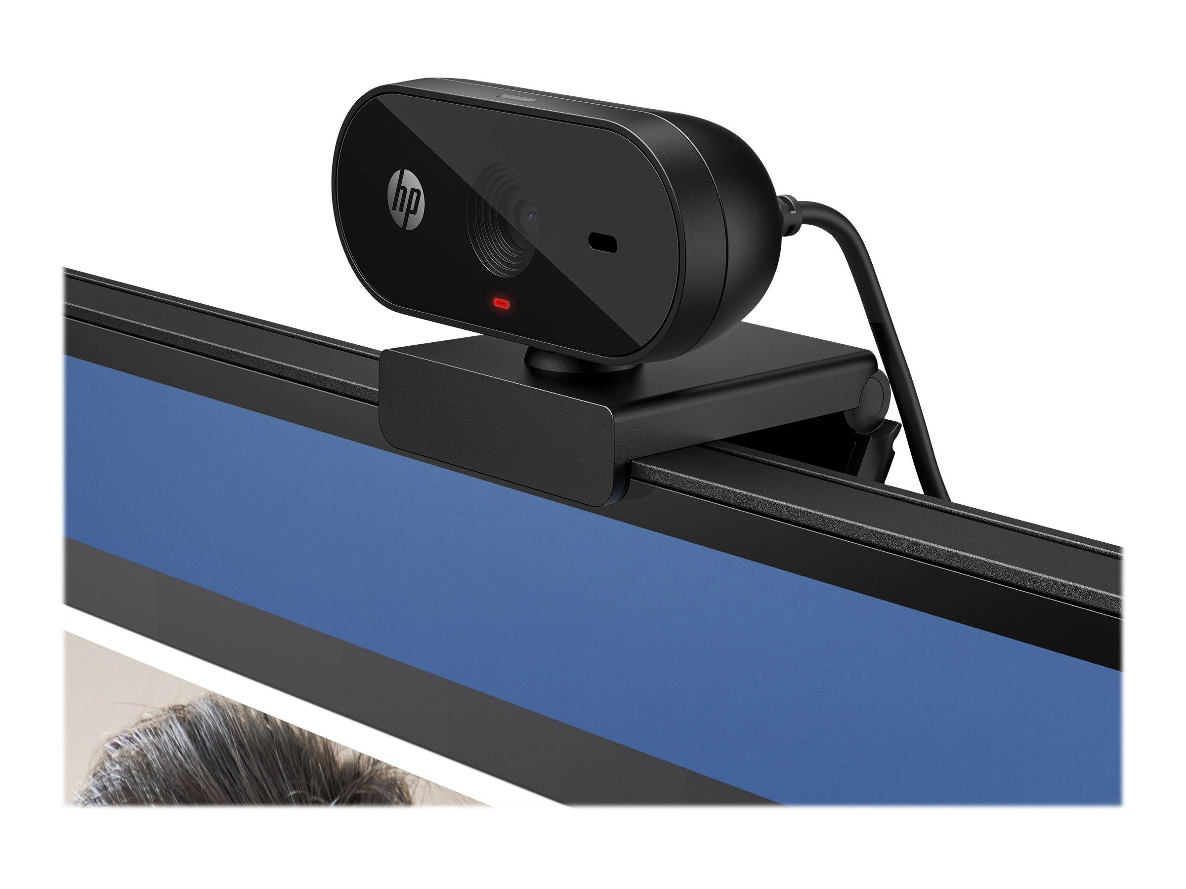 HP-Webcam, die oben auf einem Computermonitor montiert ist, mit einem kleinen roten Statuslicht und angeschlossenem Kabel.