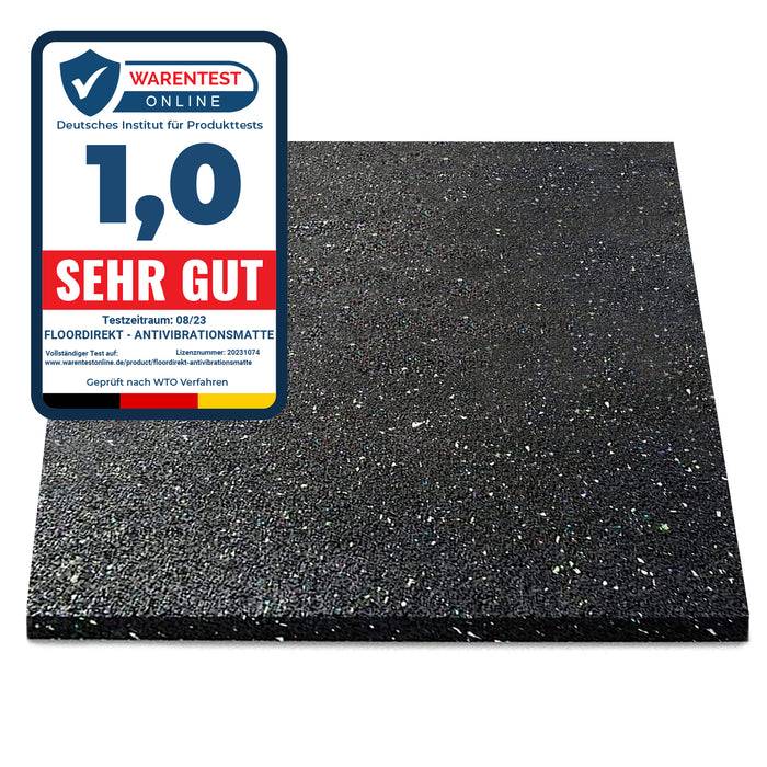 Eine schwarze Anti-Vibrations-Matte mit einer Kennzeichnung des Ratings '1,0 Sehr Gut' von 'Warentest' vom 08/23, die bestätigt, dass sie die Produkttests bestanden hat.