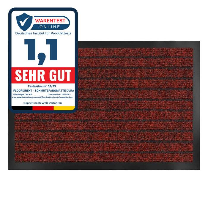 Rechteckige rote und schwarze Matte mit einer Beschriftung in der oberen linken Ecke. Die Beschriftung lautet 
