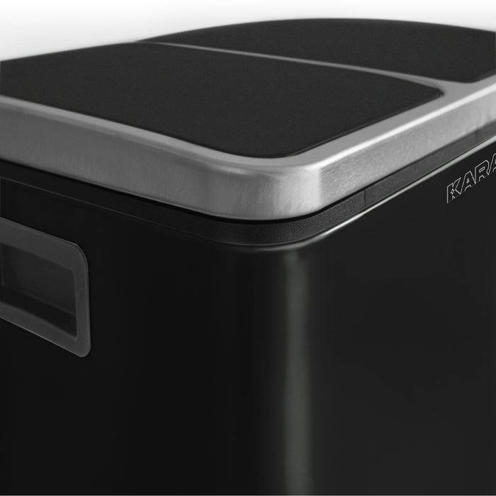 Ein schwarzer Mülleimer mit einem Deckel aus Edelstahl in modernem, elegantem Design. Der Eimer ist vor einem hellen Hintergrund positioniert, der seine polierte Oberfläche hervorhebt.