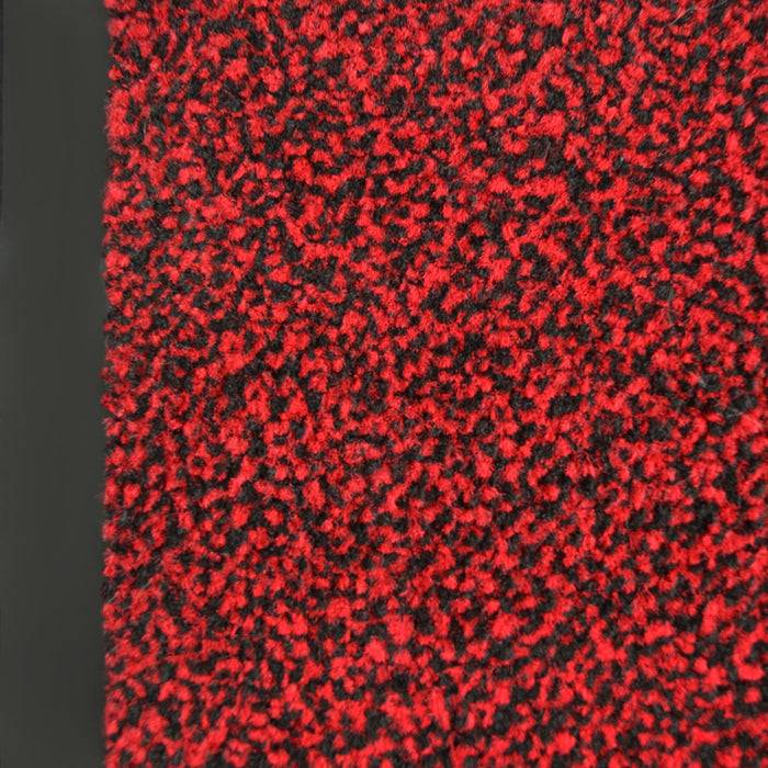 Nahaufnahme eines roten und schwarzen Gewebes mit einer dichten, flauschigen Textur.