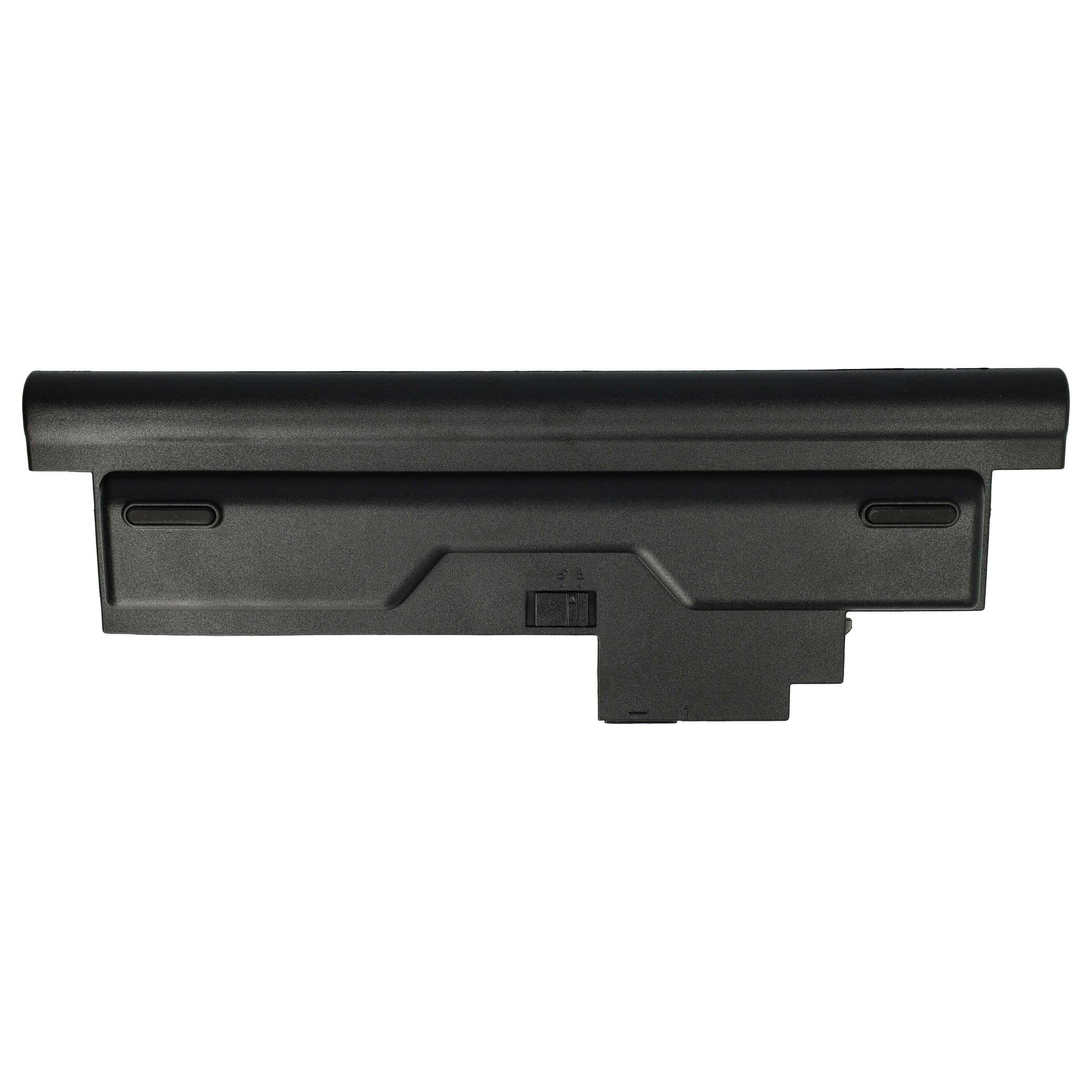 Eine schwarze Laptop-Batterie, rechteckig in Form, von oben betrachtet, wobei ein Schiebeverschlussmechanismus in der Mitte sichtbar ist.
