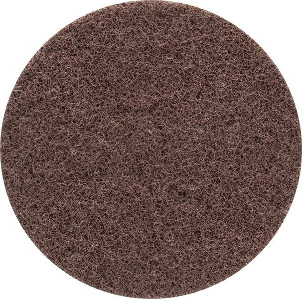 Ein kreisförmiger brauner Scheuerschwamm mit strukturierter Oberfläche, der zum Reinigen und Schrubben verwendet wird.