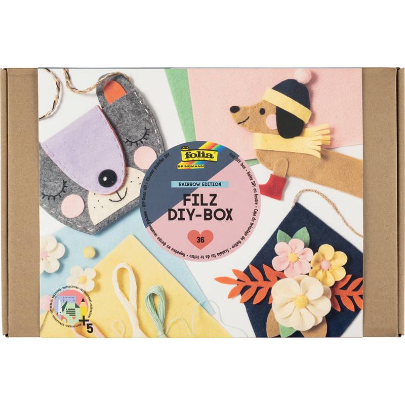 Bastelset-Verpackung mit Filz-DIY-Projekten: eine Hunde-Lesezeichenmarke, eine lila Bärenmuschel und bunte Blumen.Inklusive Materialien für Kinder ab 5 Jahren.