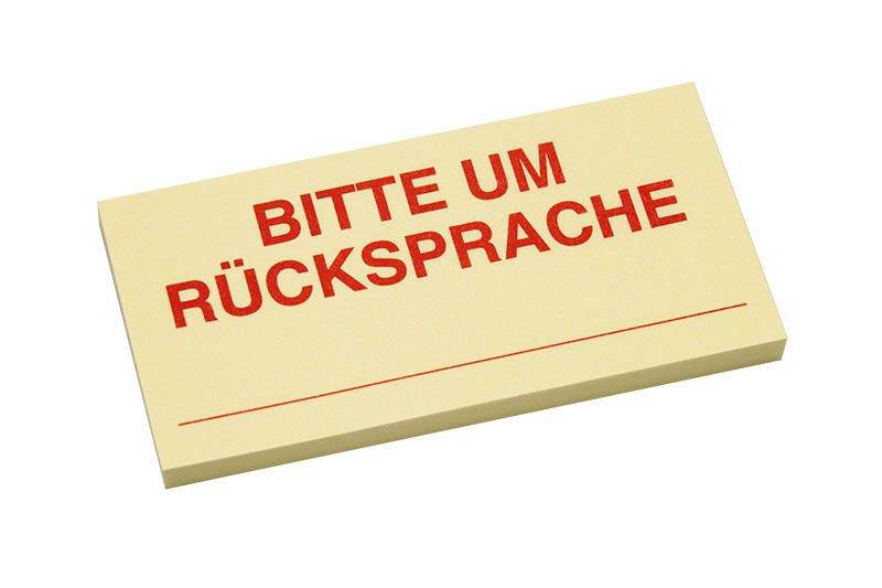 Eine gelbe Haftnotiz auf weißem Hintergrund zeigt 