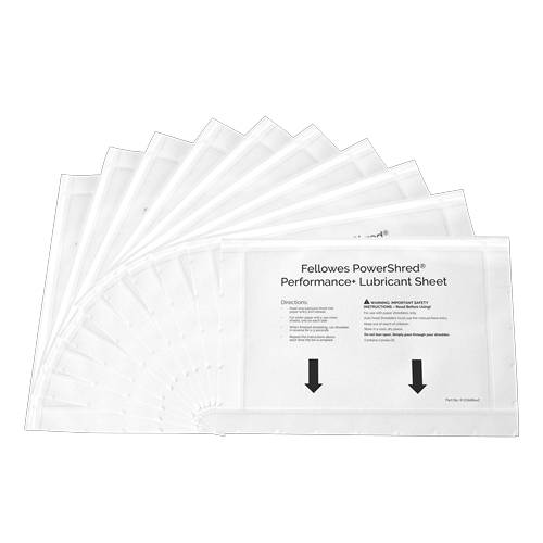 Stapel von durchsichtigen Fellowes Powershred Schmierstoff-Blättern auf schwarzem Hintergrund, mit gedruckten Anweisungen und Pfeilen auf dem obersten Blatt.