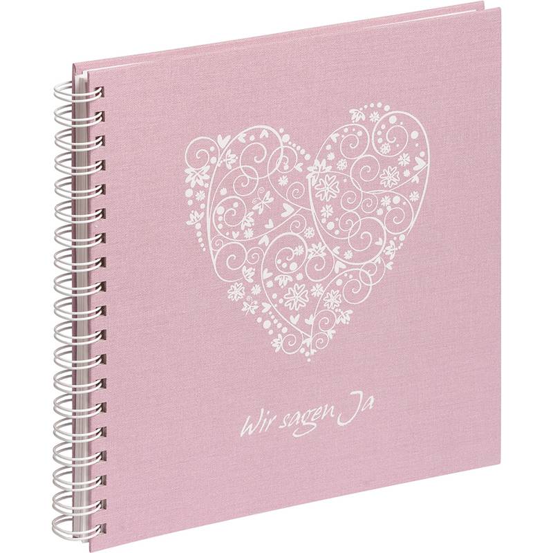Ein rosa Spiralalbum mit einem dekorativen weißen Herz und dem Text 