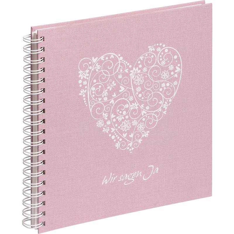 Rosa spiralgebundenes Gästebuch mit einem dekorativen weißen Herz-Design und dem Schriftzug 'Wir sagen Ja' auf dem Einband.
