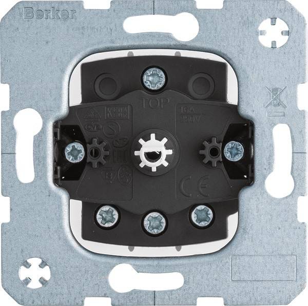Eine quadratische elektrische Steckdose oder Schaltervorrichtung mit Schraublöchern, Metallrahmen und einer zentralen rotierenden Komponente. Geeignet für Wandmontage.