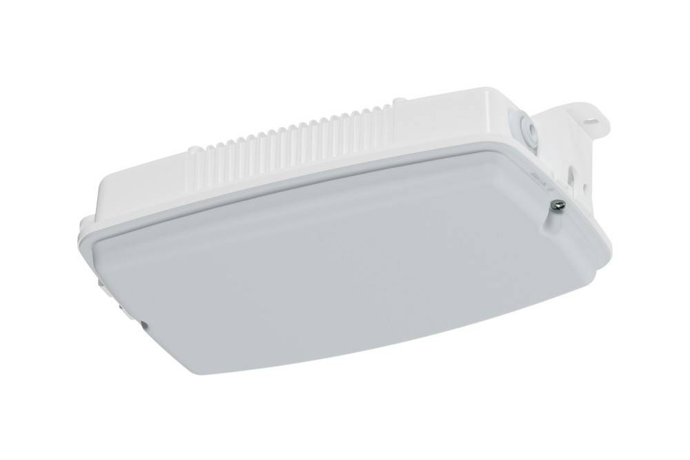 Offenes Elektroverteilerpanel mit fünf leeren Schalterplätzen und lockeren farbigen Klemmenblöcken unten.