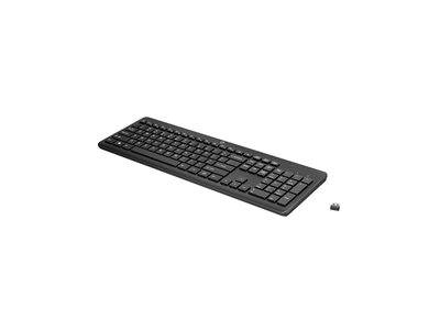 Ein schwarze kabellose Tastatur mit einem kleinen USB-Empfänger daneben, geeignet für die Verwendung am Schreibtisch.