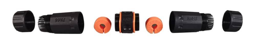 Ein schwarzer zylindrischer Verbinder mit orangefarbenen Enden, der einem Gartenschlaucharmaturen ähnelt. Zwei Seitenansichten zeigen unterschiedliche Winkel.