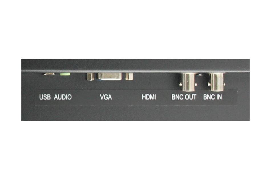 Eine Nahaufnahme eines Geräts mit beschrifteten Anschlüssen: 'USB AUDIO', 'VGA', 'HDMI', 'BNC OUT' und 'BNC IN'.