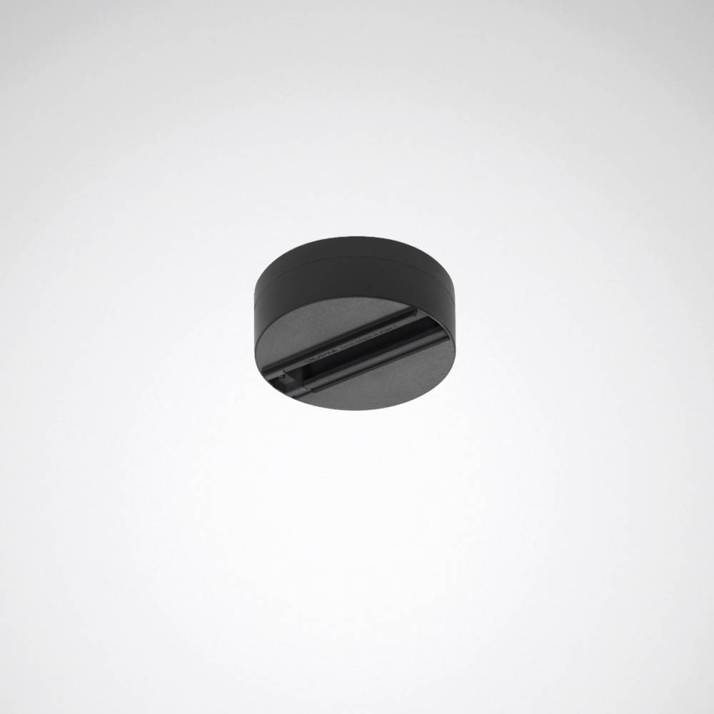 Eine schwarze, zylindrische Deckenleuchte mit glatter Oberfläche und zentraler Lichtquelle, konzipiert für moderne Innenräume.