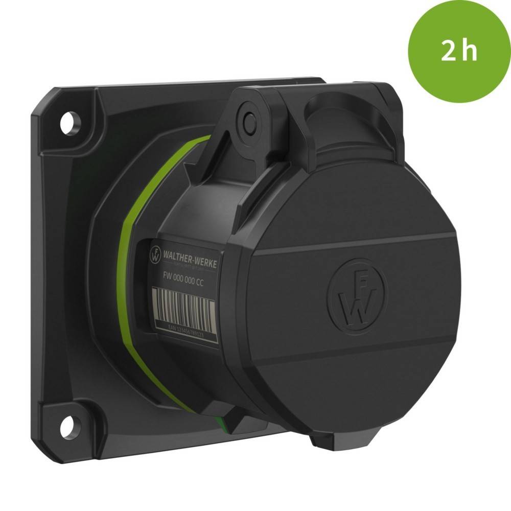 Eine schwarze industrielle Steckdose, die auf einer Tafel montiert ist, mit der Beschriftung '2h' in einem grünen Kreis, was eine Bewertung oder Spezifikation anzeigt.