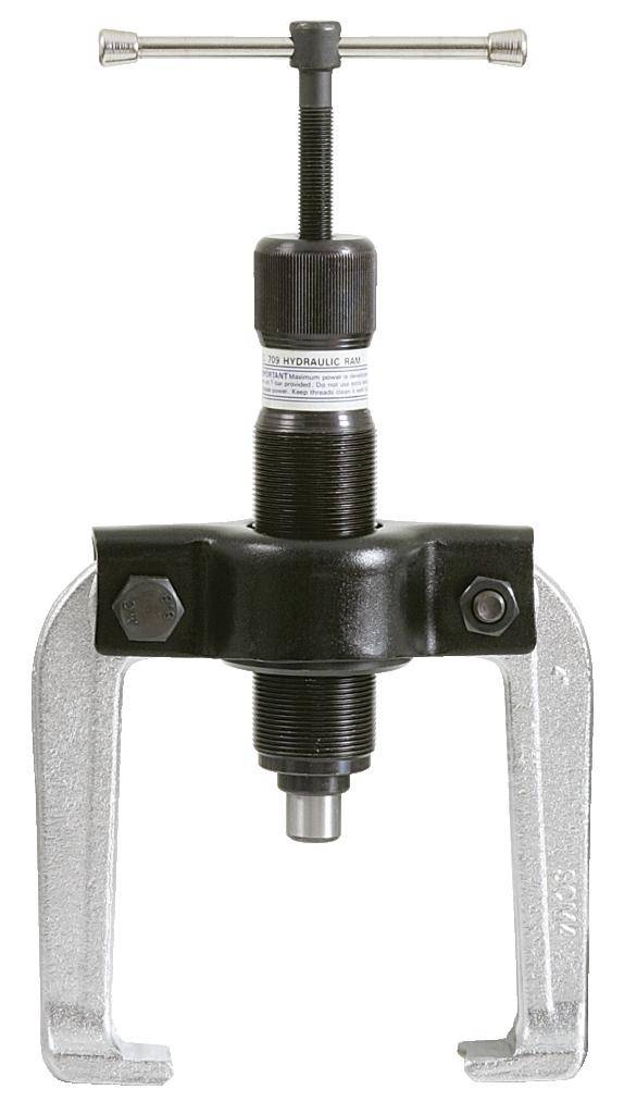 Eine hydraulische Kolbenmaschine mit einem Metallrahmen und einem zentralen Kolben, die zur Druckausübung in industriellen Anwendungen verwendet wird.