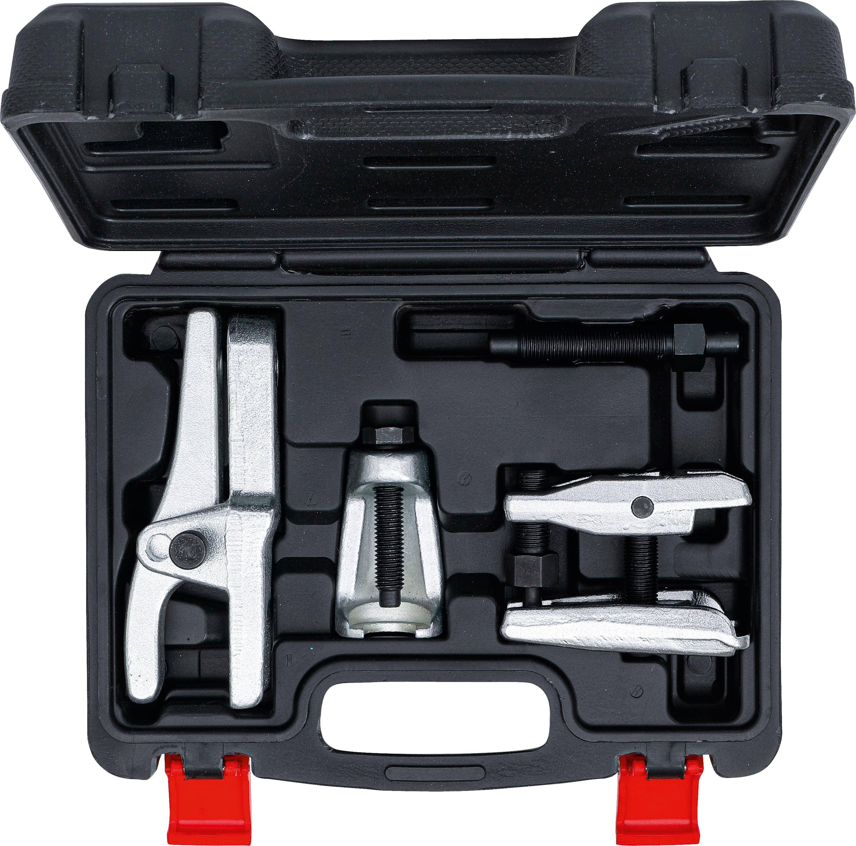 Ein Werkzeugsatz in einem offenen schwarz-roten Koffer enthält verschiedene silberne und schwarze Kfz-Abzieher, die ordentlich im Inneren angeordnet sind.