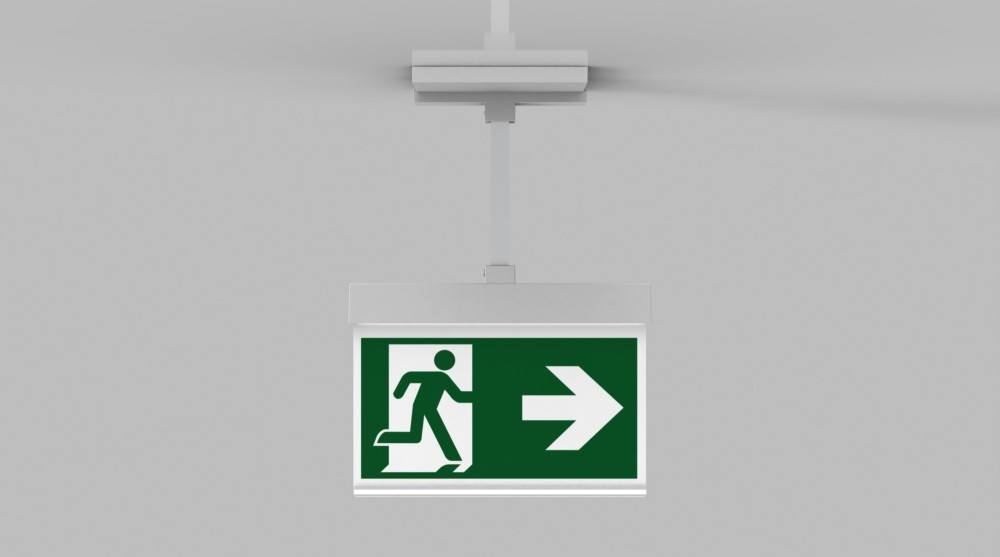 Rettungszeichenschild, das eine Person zeigt, die durch eine Tür läuft, mit einem nach rechts weisenden Pfeil, der die Richtung zum Notausgang angibt.