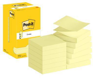 Gelbe Post-it Z-Notizen-Box neben gestapelten hellgelben Haftnotizzetteln mit Zickzack-Kanten.