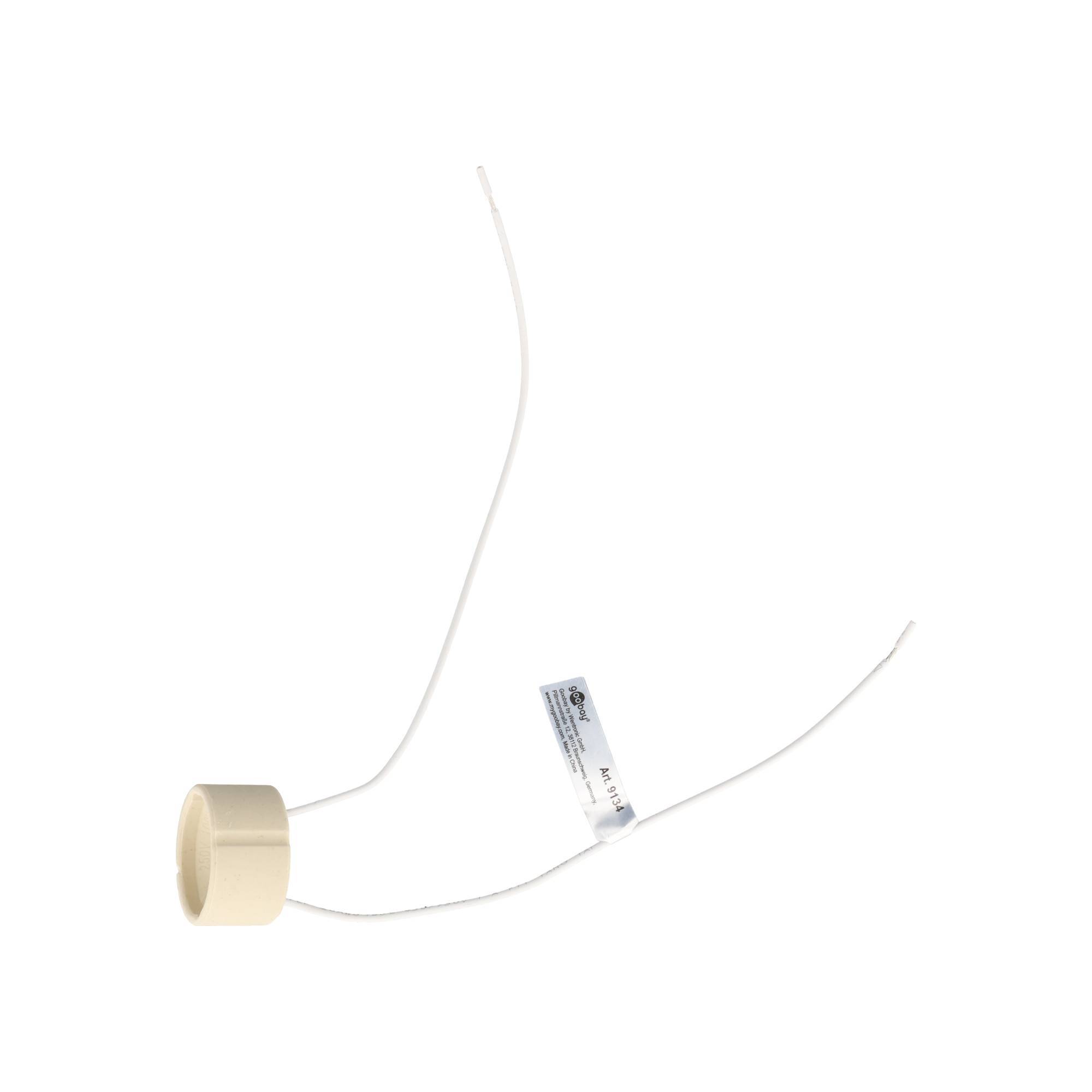Kleine beige Kunststoffkappe mit zwei dünnen weißen Drähten, die sich von ihr erstrecken, isoliert auf weißem Hintergrund.