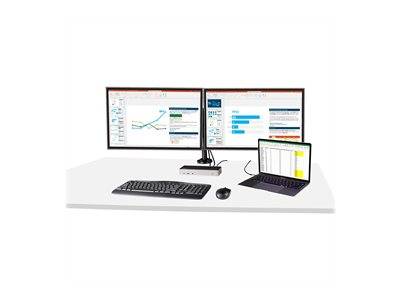 Eine moderne Büroeinrichtung mit zwei Desktop-Monitoren, die Grafiken und Daten anzeigen, einem Laptop mit einer Tabellenkalkulation, einer Tastatur und einer Maus.