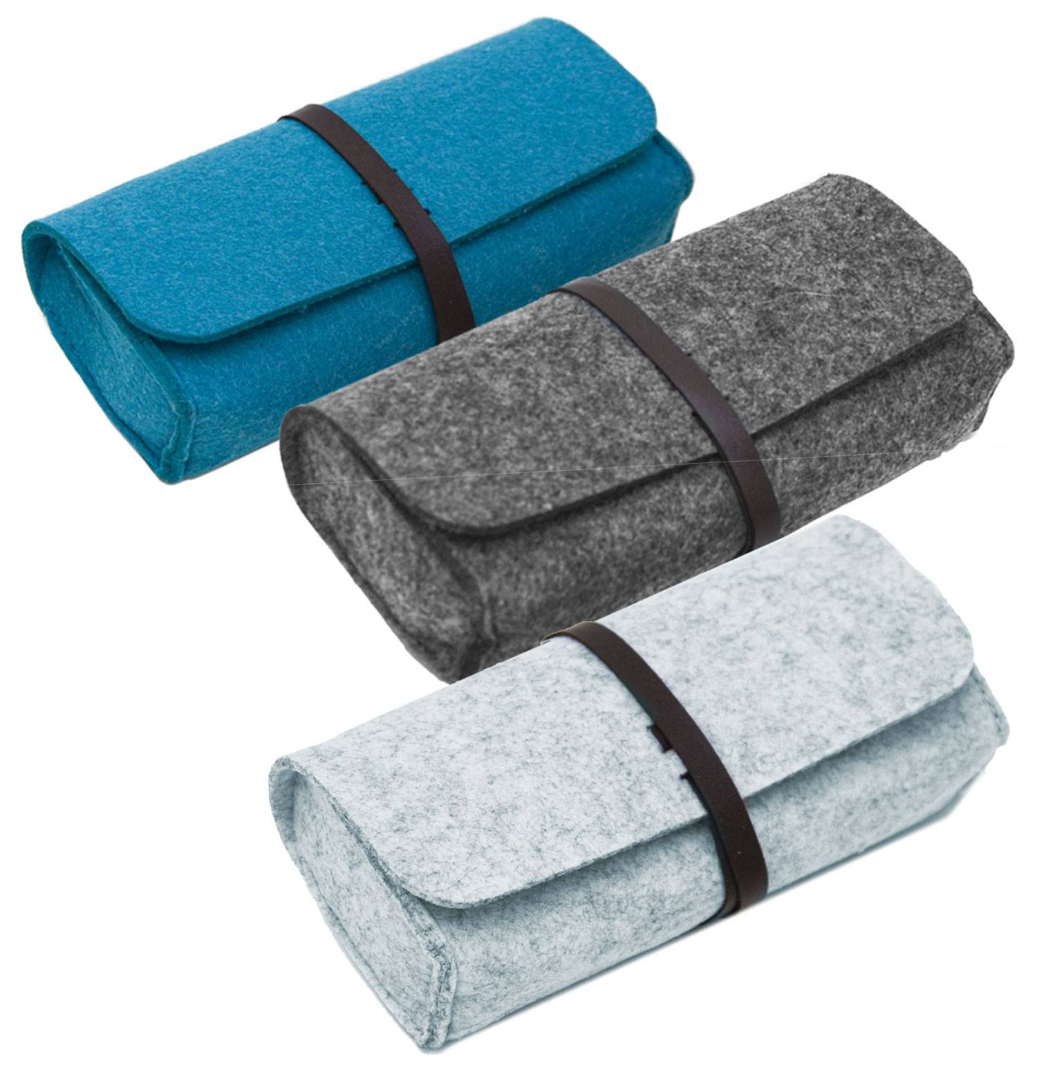 Drei Filletui für Brillen in Blau, Grau und Hellblau, jeweils mit einem dunklen Riemen gesichert.