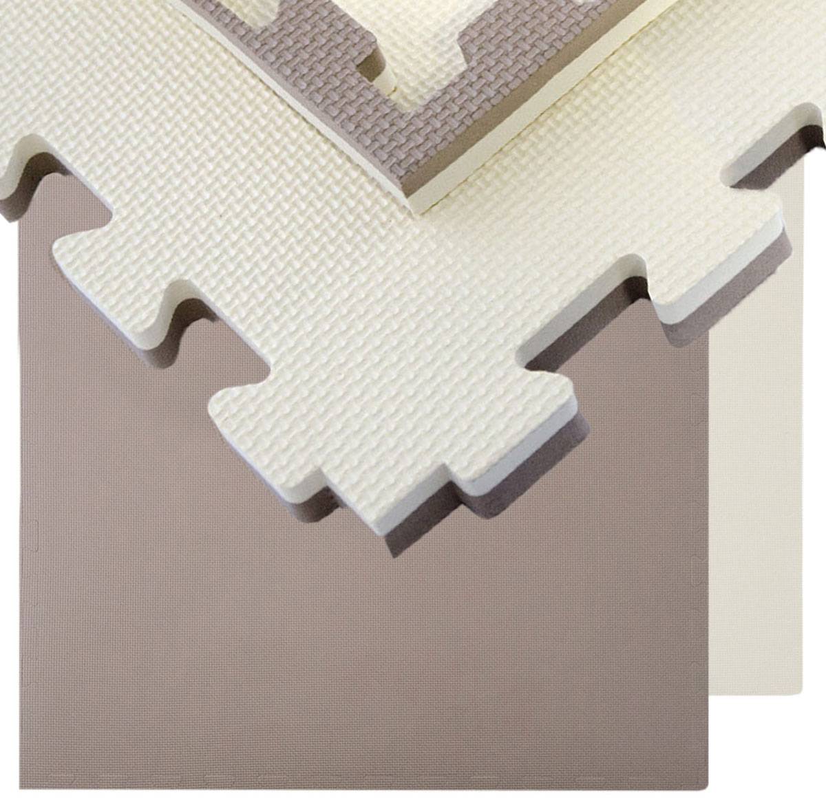 Verschlungene Schaumstoff-Bodenmatte in Beige und Weiß mit Puzzle-Kanten und strukturierter Oberfläche.