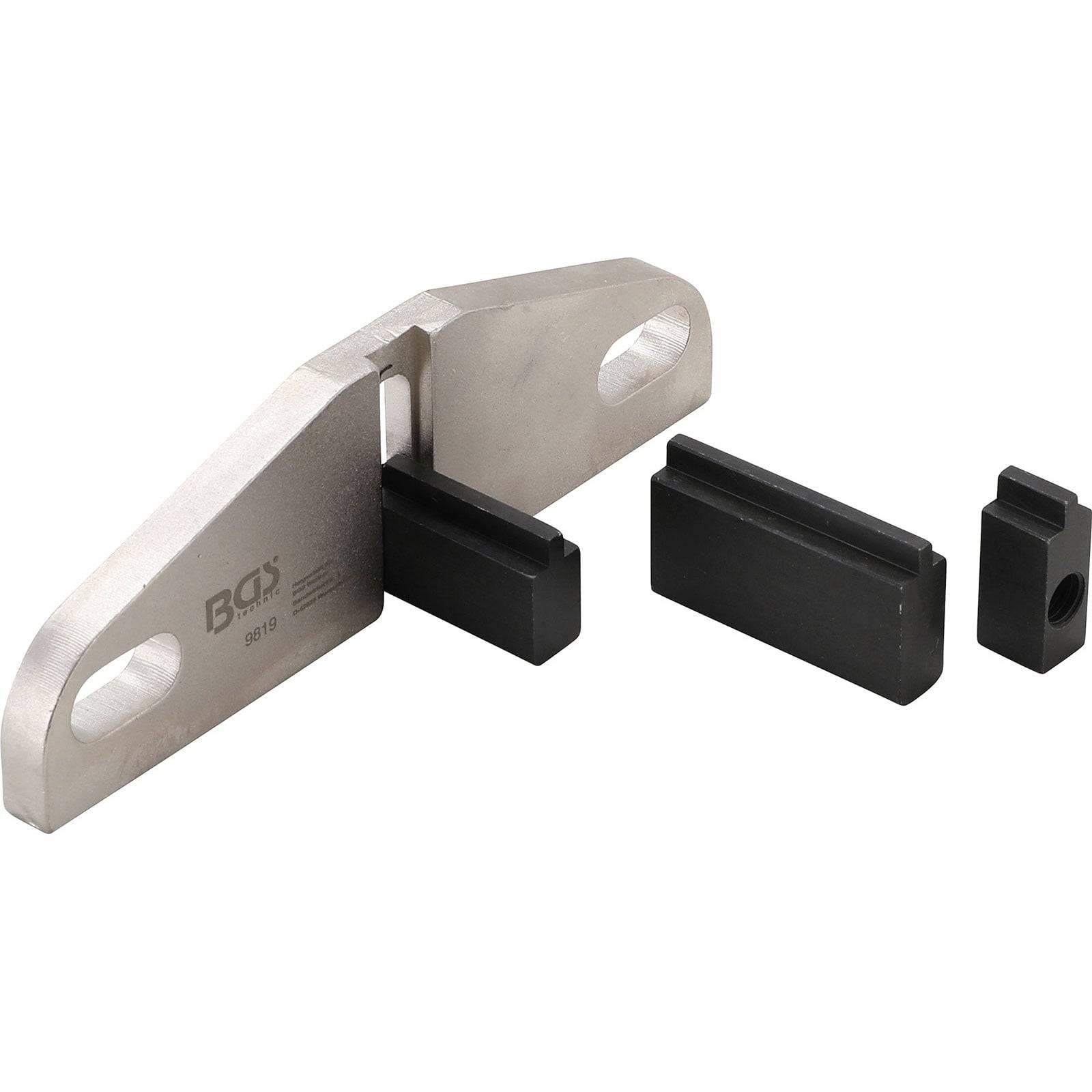 Metallwerkzeug mit zwei schwarzen Befestigungen und einer kleinen Komponente. Wird zum Halten oder Ausrichten von Teilen verwendet.