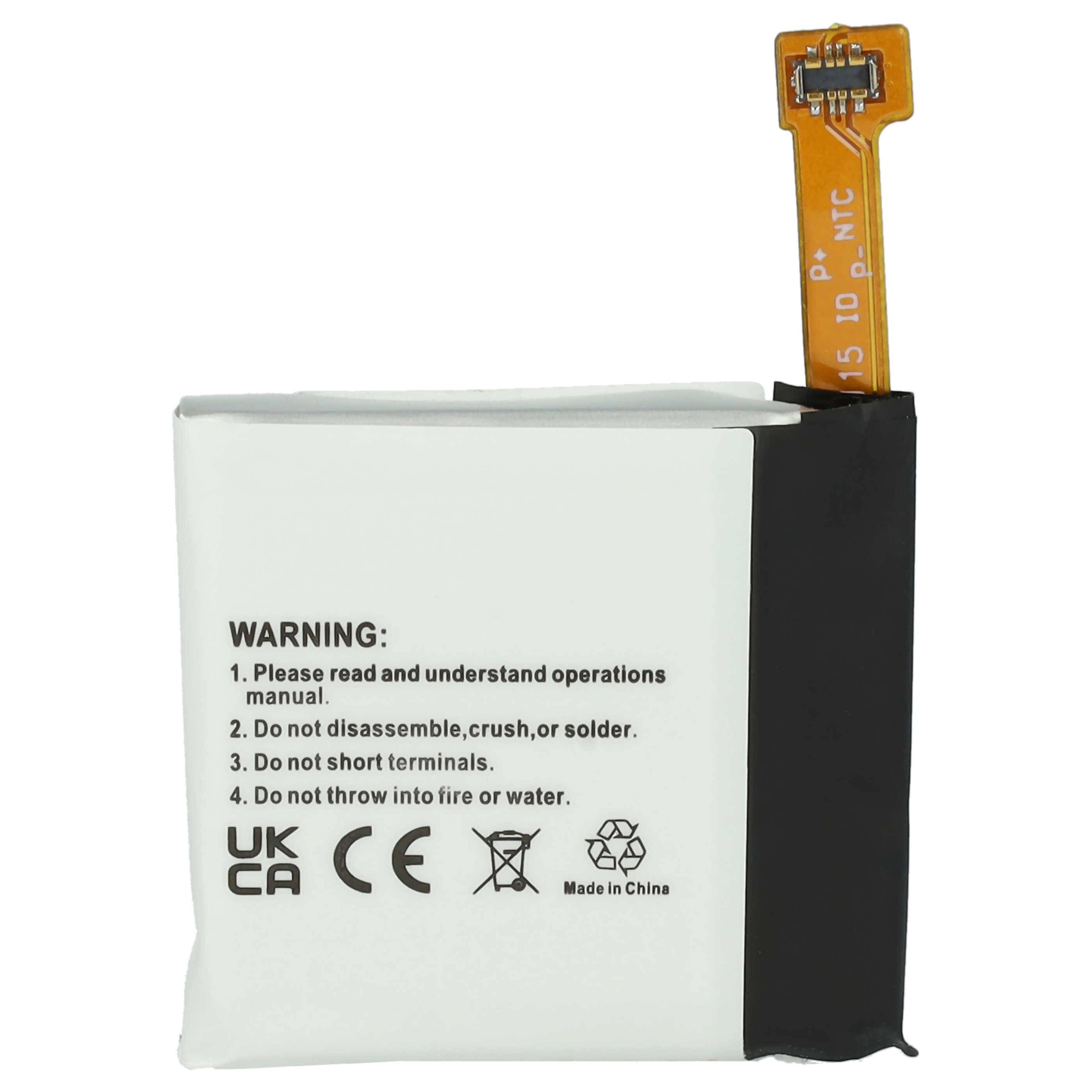 Eine kleine rechteckige Batterie mit einer Warnaufschrift, die Anweisungen enthält, sie nicht zu zerlegen, zu zerquetschen oder Feuer oder Wasser auszusetzen.
