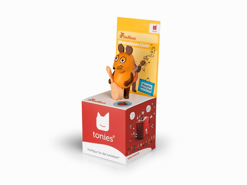 Eine Tonies-Spielfigur einer Cartoon-Maus auf ihrer Verpackungsschachtel mit rotem Tonies-Logo und gelbem illustriertem Hintergrund.
