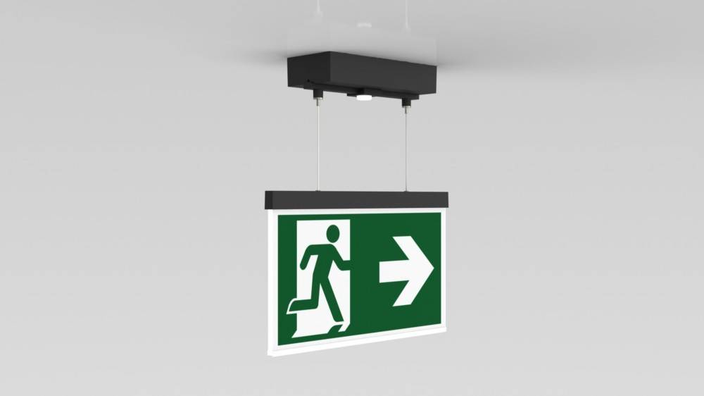 Deckeninstalliertes Fluchtzeichenschild mit grünem Hintergrund, das eine Person zeigt, die nach rechts läuft und die Richtung zum Notausgang angibt.