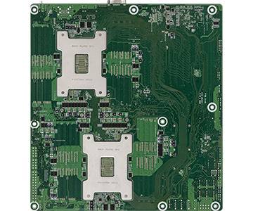 Grüne Leiterplatte mit zwei großen Metallmontageklammern und sichtbaren Leiterbahnen, wahrscheinlich ein Computer-Motherboard oder eine elektronische Baugruppe.