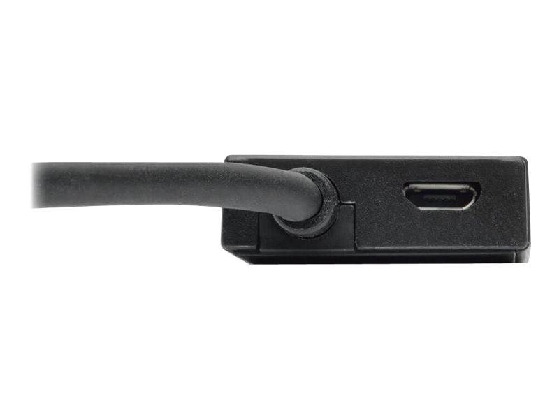 Nahaufnahme eines schwarzen Kabels, das in ein kleines rechteckiges Gerät mit sichtbarem USB-C-Anschluss auf der rechten Seite eingesteckt ist.
