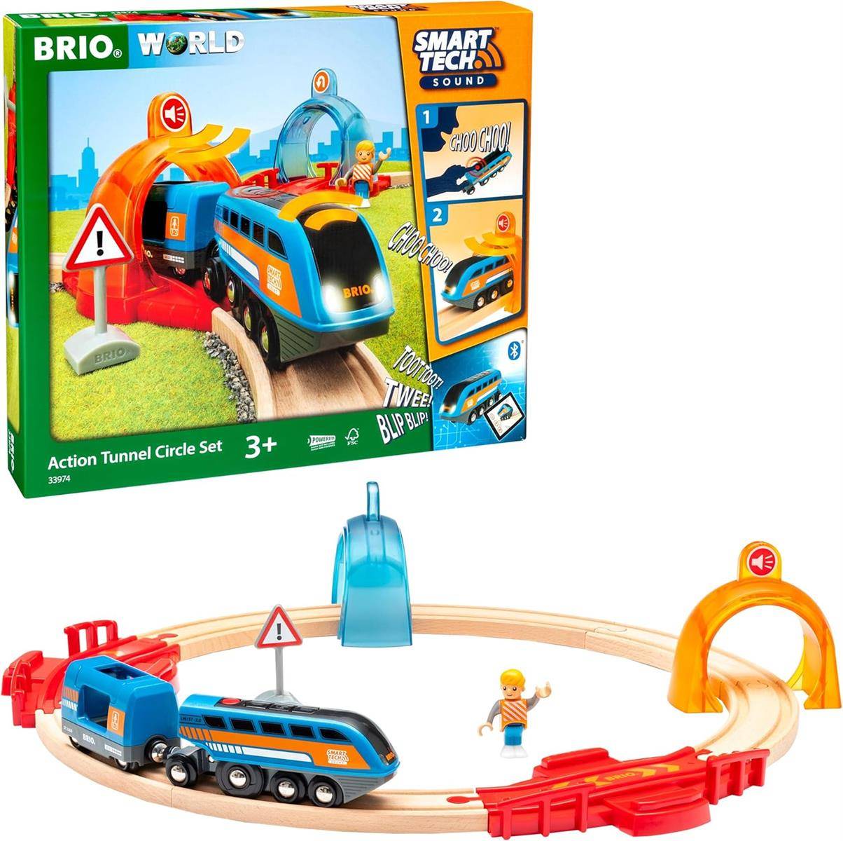 BRIO World Smart Tech Sound Action Tunnel Circle Set Spielzeugeisenbahnset mit blauem und orangefarbenem Zug, Tunnel, Gleisschleife, Warnschild und Figur; Schachtel oben über dem zusammengebauten Set gezeigt.