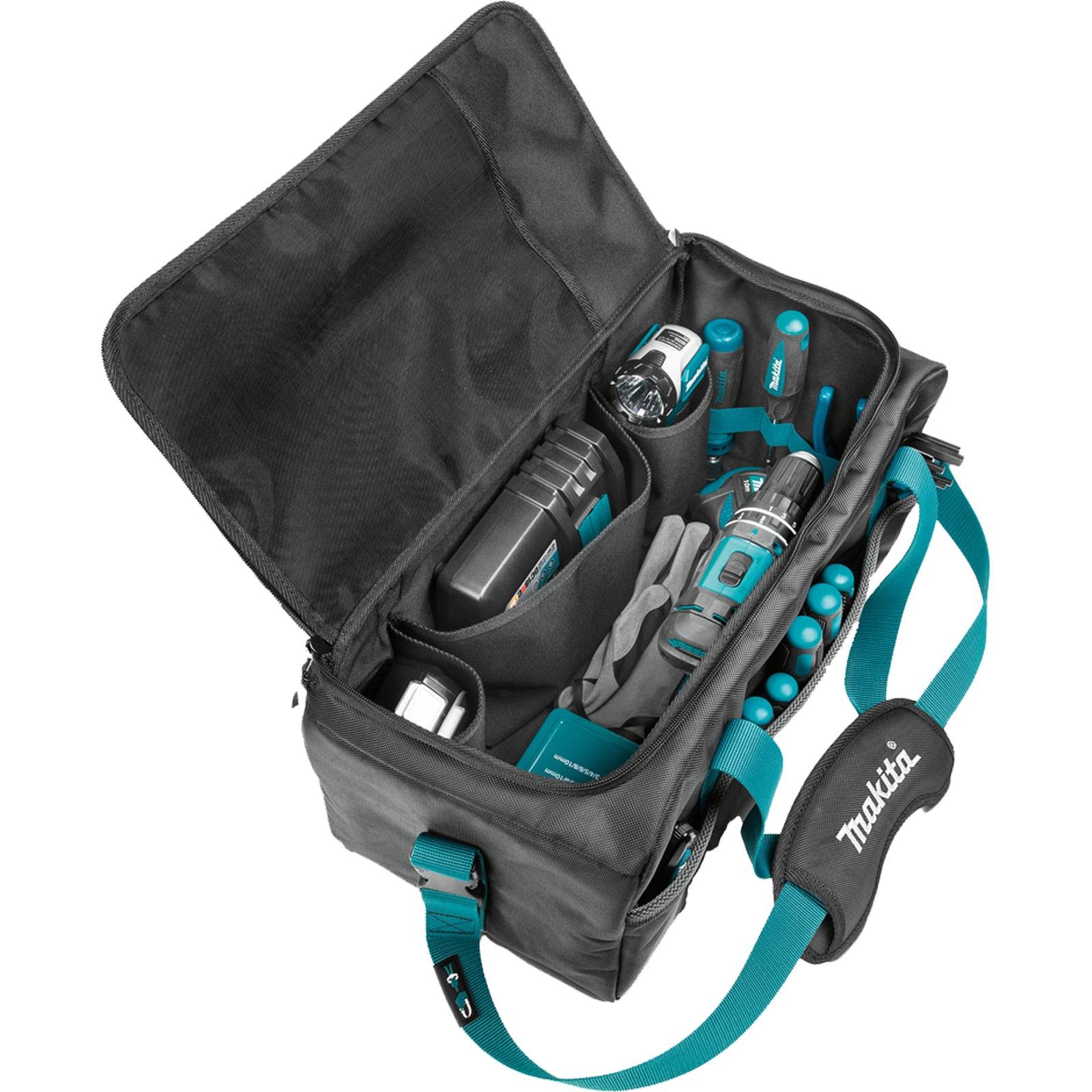 Eine offene schwarze Werkzeugtasche mit petrolblauen Akzenten enthält verschiedene Handwerkzeuge, Bohraufsätze und ein Paar Arbeitshandschuhe, die eine organisierte Aufbewahrung veranschaulicht.