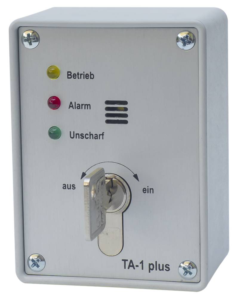 Wandmontierter Alarmkontrollkasten mit der Bezeichnung 'TA-1 plus' mit Schlüsselschalter und Statusleuchten für 'Betrieb', 'Alarm' und 'Unscharf', sowie 'aus' und 'ein' Einstellungen.