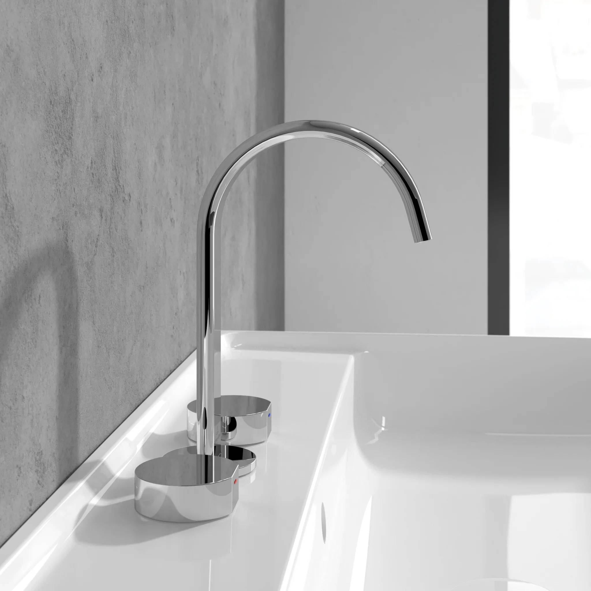 Moderner Chromhahn über einem weißen Waschbecken an einer grauen Wand in einem minimalistischen Badezimmer.