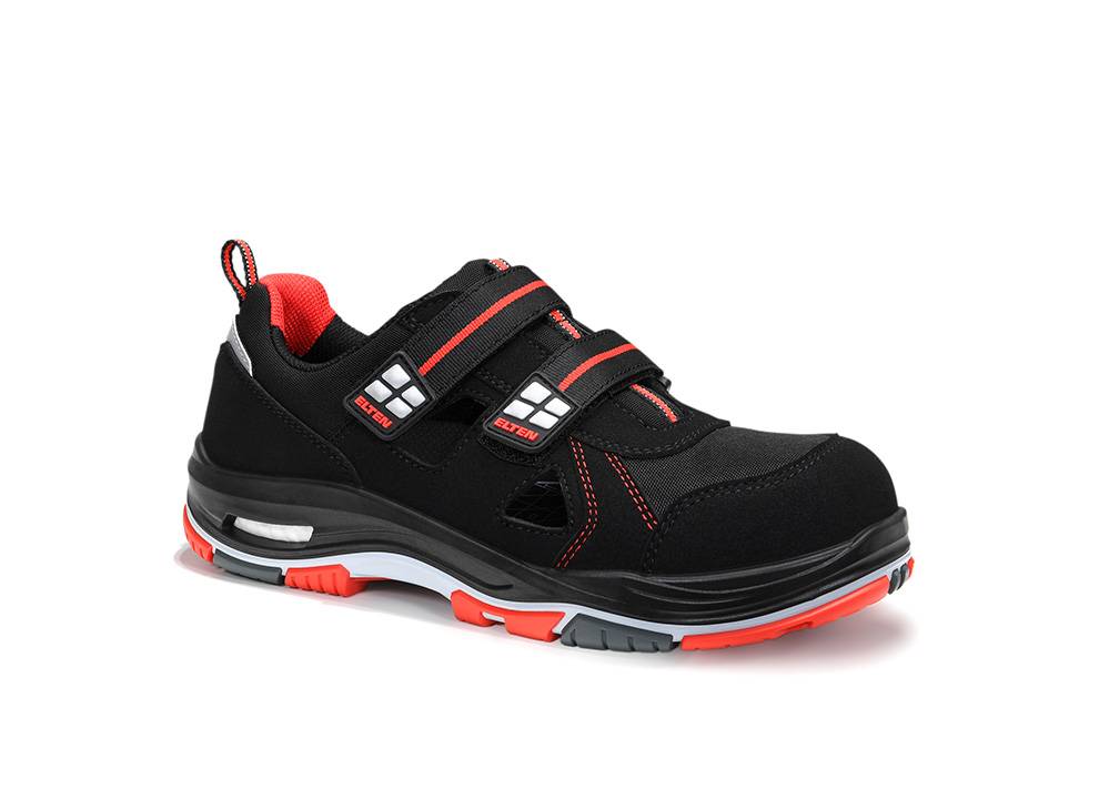 Ein schwarzer und roter athletischer Schuh mit Klettverschlüssen und einer robusten Sohle, entwickelt für Komfort und Stabilität, geeignet für Sportaktivitäten.